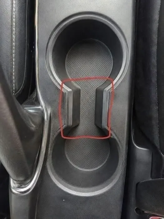Unlocking the Hidden Utility of the Narrow Slot Located Between Your Vehicle’s Cup Holders